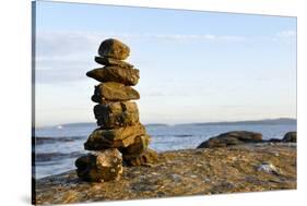 Canada, British Columbia, Russell Island. Rock Inukshuk in front of Salt Spring Island.-Kevin Oke-Stretched Canvas