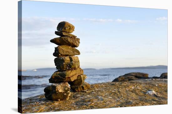 Canada, British Columbia, Russell Island. Rock Inukshuk in front of Salt Spring Island.-Kevin Oke-Stretched Canvas
