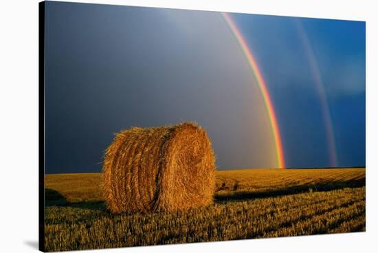 Canada, Manitoba. Double rainbow and hay bale after prairie storm.-Jaynes Gallery-Stretched Canvas