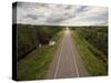 Canada, Manitoba, Thompson, Aerial View of Highway Through Boreal Forest-Paul Souders-Stretched Canvas