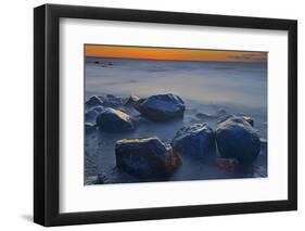 Canada, Manitoba, Winnipeg. Waves on shoreline rocks of Lake Winnipeg at dusk.-Jaynes Gallery-Framed Photographic Print