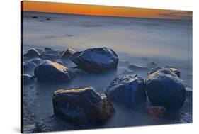 Canada, Manitoba, Winnipeg. Waves on shoreline rocks of Lake Winnipeg at dusk.-Jaynes Gallery-Stretched Canvas