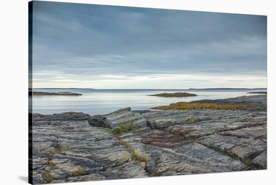 Canada, Nova Scotia, Blue Rocks. Coastal fishing village, rocky shoreline.-Walter Bibikow-Stretched Canvas