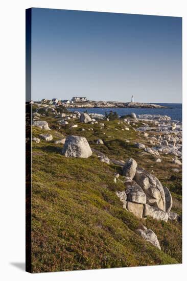 Canada, Nova Scotia, Peggy's Cove. Fishing village and lighthouse.-Walter Bibikow-Stretched Canvas