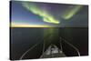 Canada, Nunavut, Aurora Borealis Glows in Night Sky Above Hudson Bay-Paul Souders-Stretched Canvas