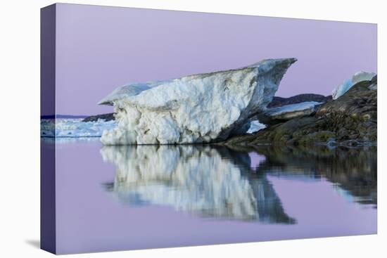 Canada, Nunavut, Iceberg Reflected in Calm Waters at Dusk-Paul Souders-Stretched Canvas