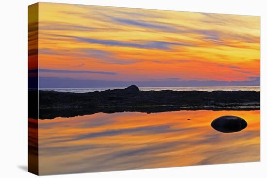 Canada, Quebec, Gulf of St. Lawrence. Reflection on water at sunset.-Mike Grandmaison-Stretched Canvas