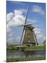 Canal and Windmill at Kinderdijk, Unesco World Heritage Site, Holland-Gavin Hellier-Mounted Photographic Print