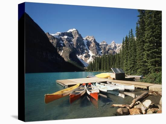 Canoe Moored at Dock on Moraine Lake, Banff NP, Alberta, Canada-Adam Jones-Stretched Canvas