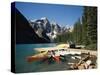 Canoe Moored at Dock on Moraine Lake, Banff NP, Alberta, Canada-Adam Jones-Stretched Canvas