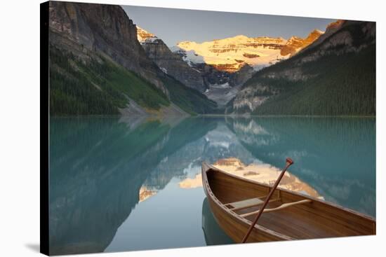 Canoe on Lake Louise at Sunrise-Miles Ertman-Stretched Canvas