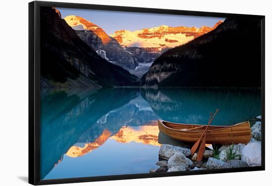 Canoe On Lake Louise-null-Framed Poster