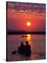 Canoeing at Sun Rise on the Zambezi River-John Warburton-lee-Stretched Canvas