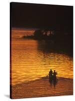 Canoers on Lake Metigoshe at Sunset, North Dakota, USA-Chuck Haney-Stretched Canvas