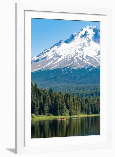 Canoes and rowboat on the still waters of Trillium Lake with Mount Hood, part of the Cascade Range,-Martin Child-Framed Photographic Print