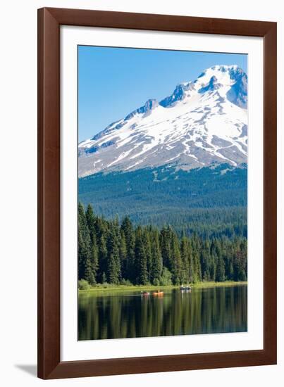 Canoes and rowboat on the still waters of Trillium Lake with Mount Hood, part of the Cascade Range,-Martin Child-Framed Photographic Print