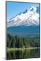 Canoes and rowboat on the still waters of Trillium Lake with Mount Hood, part of the Cascade Range,-Martin Child-Mounted Photographic Print