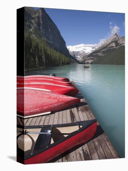 Canoes for Hire on Lake Louise, Banff National Park, UNESCO World Heritage Site, Alberta, Rocky Mou-Martin Child-Stretched Canvas
