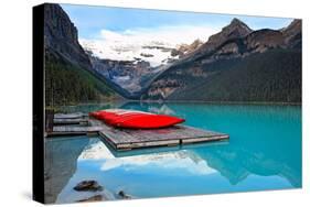 Canoes of Lake Louise, Alberta, Canada-George Oze-Stretched Canvas