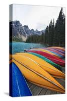 Canoes on a Dock, Moraine Lake, Canada-George Oze-Stretched Canvas