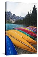 Canoes on a Dock, Moraine Lake, Canada-George Oze-Stretched Canvas