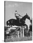 Capt. Theodore Galiza, Russian Riding Master, Taking Triple Bars, Horse Show Organized-Alfred Eisenstaedt-Stretched Canvas