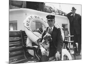 Captain Lane Erickson of the Great Bear with Dog, 1916-Asahel Curtis-Mounted Giclee Print