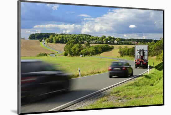Car and Truck Driving on Winding Country Road, Storm Clouds, Motion Blur, Thuringia, Germany-Andreas Vitting-Mounted Photographic Print