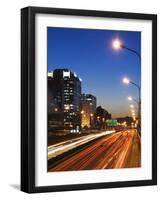 Car Light Trails and Modern Architecture on a City Ring Road, Beijing, China-Kober Christian-Framed Photographic Print
