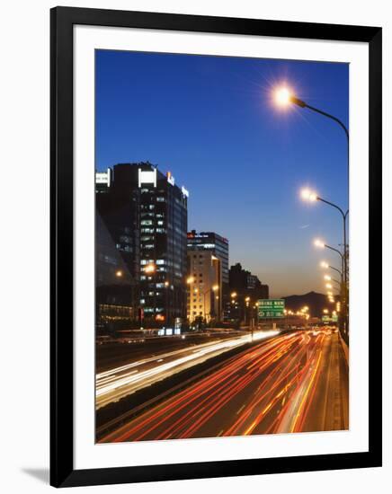 Car Light Trails and Modern Architecture on a City Ring Road, Beijing, China-Kober Christian-Framed Photographic Print