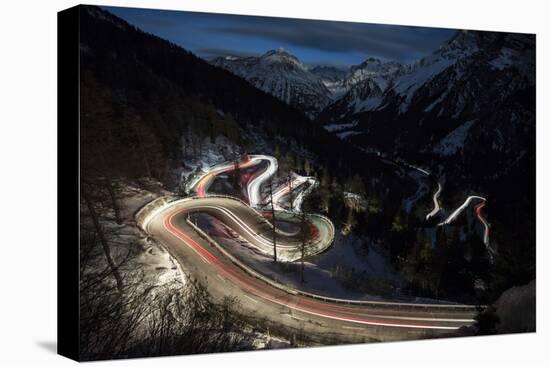 Car lights on the curvy Maloja Pass road at night, Maloja Pass, Engadine, Province of Graubunden, S-Francesco Vaninetti-Stretched Canvas