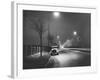 Car on a Lit Road-null-Framed Photographic Print