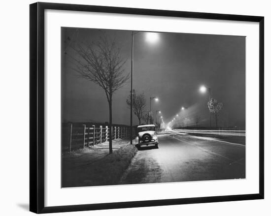 Car on a Lit Road-null-Framed Photographic Print