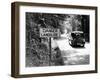 Car Passing 'Danger Landslide' Sign (B&W)-Hulton Archive-Framed Photographic Print