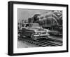 Car Riding the Rails next to a Train-null-Framed Photographic Print