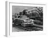 Car Riding the Rails next to a Train-null-Framed Photographic Print