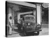 Car Sitting at a Gas Station on the Island of Martinique-David Scherman-Stretched Canvas