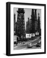 Car Traffic on Highway Next to Advertising Billboards and Oil Well Towers, Signal Hill Oil Field-Andreas Feininger-Framed Photographic Print