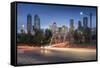 Car trail lights through Macdonal Avenue bridge and Downtown skyline at dusk, Calgary, Alberta, Can-Frank Fell-Framed Stretched Canvas