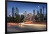 Car trail lights through Macdonal Avenue bridge and Downtown skyline at dusk, Calgary, Alberta, Can-Frank Fell-Framed Photographic Print