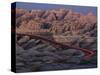 Car Traveling Through Badlands National Park-Layne Kennedy-Stretched Canvas