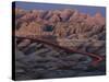 Car Traveling Through Badlands National Park-Layne Kennedy-Stretched Canvas