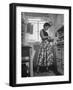 Career Girl Hostedd Joan Wilson in skirt and sleeveless blouse cooking in kitchen-Nina Leen-Framed Photographic Print