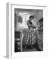 Career Girl Hostedd Joan Wilson in skirt and sleeveless blouse cooking in kitchen-Nina Leen-Framed Photographic Print