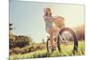 Carefree Woman Riding Bicycle in Park Having Fun on Summer Afternoon-warrengoldswain-Mounted Photographic Print