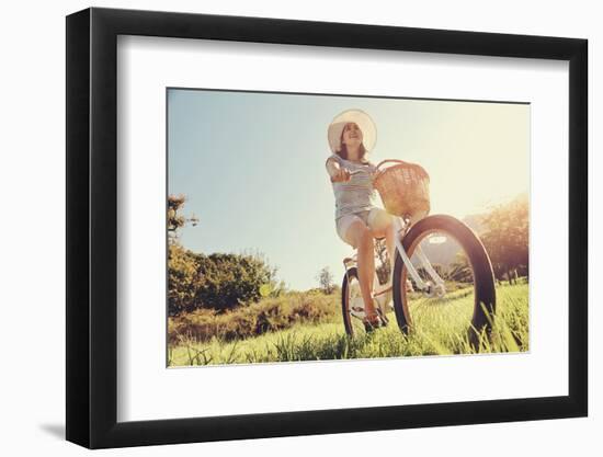 Carefree Woman Riding Bicycle in Park Having Fun on Summer Afternoon-warrengoldswain-Framed Photographic Print