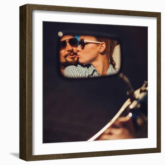 Carefree Young Couple in Sunglasses Kissing Reflected in the Mirror of a Motorcycle-Maksim Ladouski-Framed Photographic Print