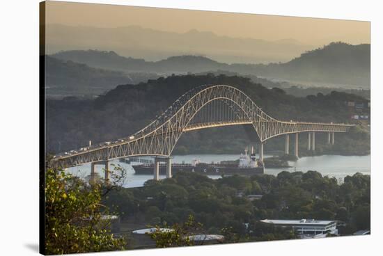 Cargo boat passes the Bridge of the Americas on the Panama Canal, Panama City, Panama, Central Amer-Michael Runkel-Stretched Canvas