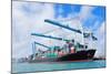 Cargo Ship at Miami Harbor with Crane and Blue Sky over Sea.-Songquan Deng-Mounted Photographic Print