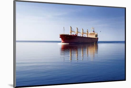 Cargo Ship Sailing in Still Water-aleksey.stemmer-Mounted Photographic Print